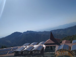 Rooftop solar power plant with rows of photovoltaic panels