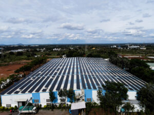 Rooftop solar power plant with rows of photovoltaic panels