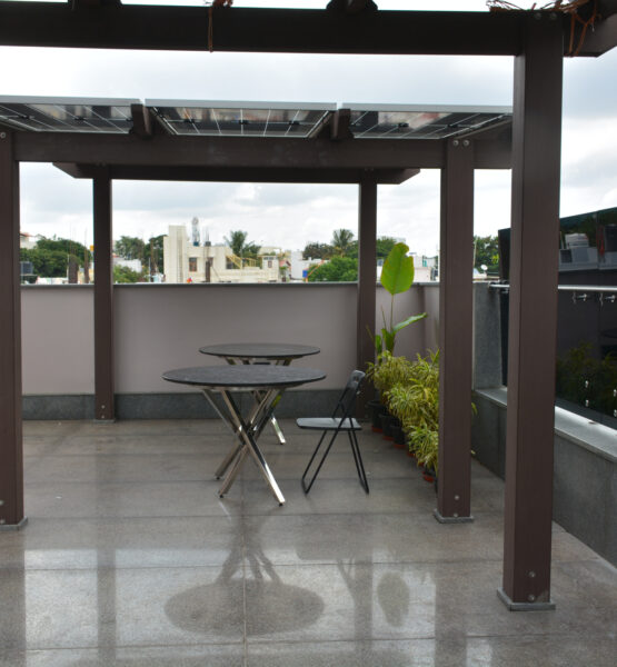 Rooftop pergola structure with integrated solar panels.