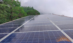 Large solar power plant with rows of photovoltaic panels.
