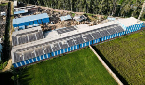 Rooftop solar power plant with rows of photovoltaic panels - Konifer