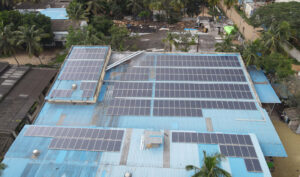 Rooftop solar power plant with rows of photovoltaic panels - panchami agro solar installation